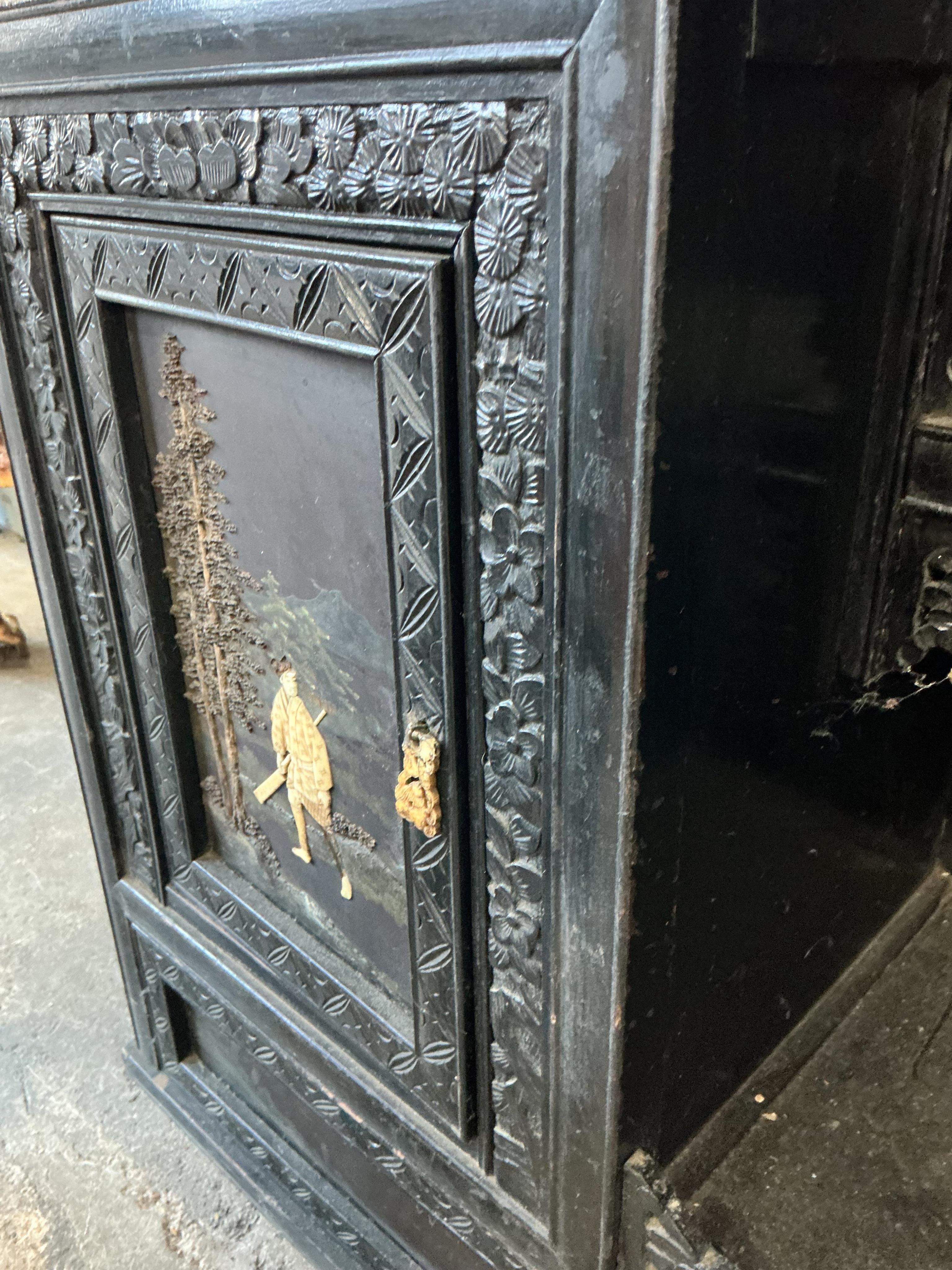 A Japanese Meiji period ebonised cabinet, width 110cm, depth 32cm, height 150cm CITES Submission reference Q4A31H9Q